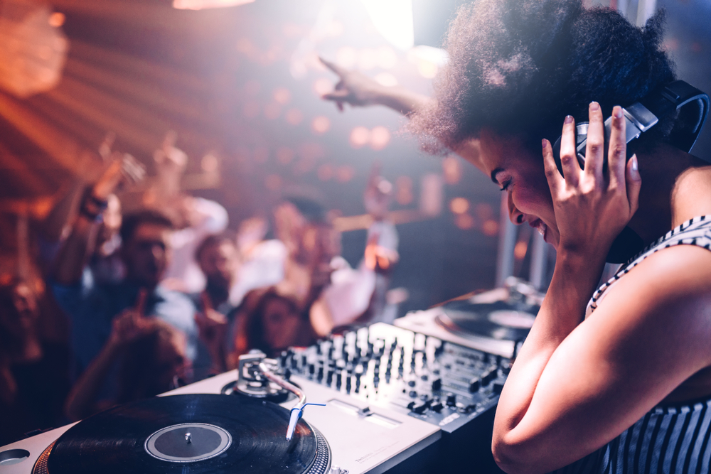 DJ woman playing club