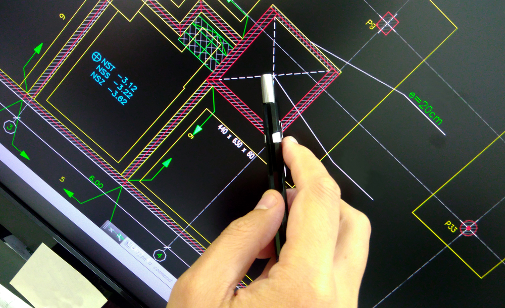 a professional using AutoCAD in the office